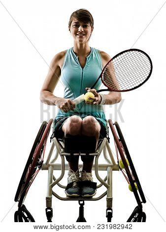 one caucasian young ped tennis player woman in welchair sport tudio in silhouette isolated on white background