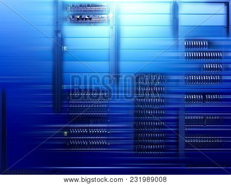 Big Data Dark Server Room With Bright Blue Equipment