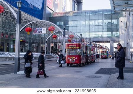Yanjixi, Jilin, China - March 9, 2018: Snack Bars Or Taverns On Wheels Prepare Fast Food Near The Sh
