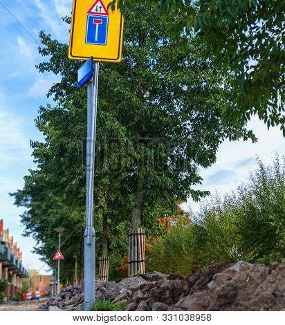 Caution Signs. Warning Signs And Fencing Construction 
 Repair Work On Pedestrian Street In City.