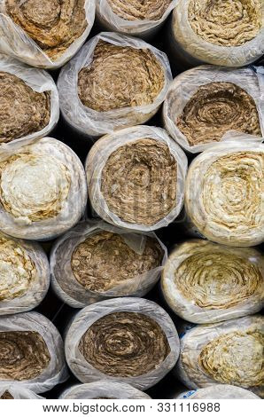 Close Up  Front View Of  Round Basalt Mineral Wool Packages  In Plastic Foil .