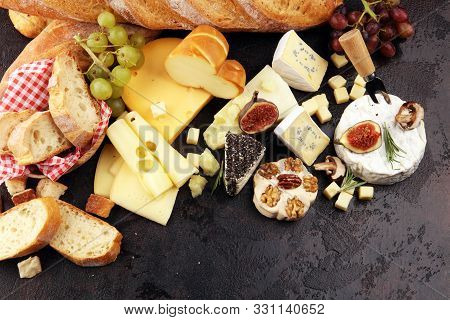 Different Sorts Of Cheese. Cheese Platter With Different Cheese And Spice