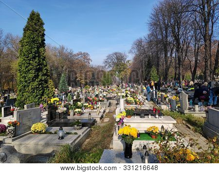 Bytom, Poland - November 1, 2019: People Visit Cemetery During All Saints Day In Bytom. All Saints D