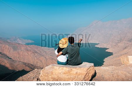 Couple Enjoying View Over Fjord Khor Najd In Musandam Oman