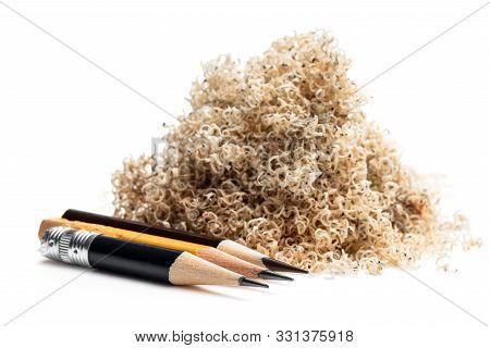 Oversharpened  Pencil In Front Of The Heap Of Shavings. Concept Of The Fruitless Design Or Art Work