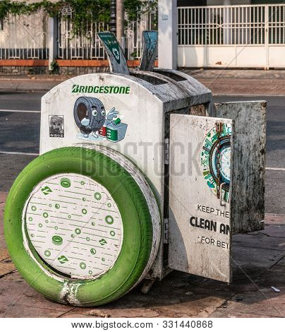 Da Nang, Vietnam - March 10, 2019: Light Gray Filthy Trashcan Sponsored By Bridgestone Tires And Wit