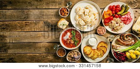 Selection Of Traditional Ukrainian Food - Borsch, Perogies, Potato Cakes, Pickled Vegetables, Top Vi