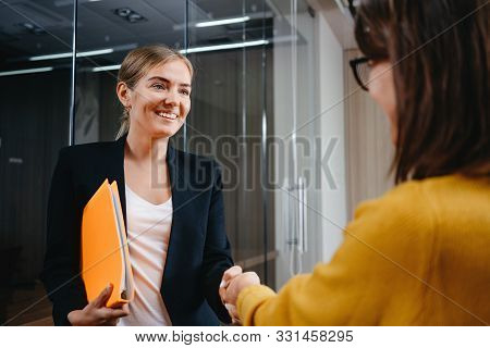 Happy Business People Partnership Handshake Meeting Concept. Handsome Business Woman Handshaking Aft