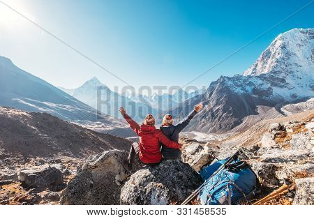 Couple Rising Arms Rejoicing Everest Base Camp Trekking Route Near Dughla 4620m. Backpackers Left Ba