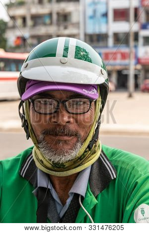 Da Nang, Vietnam - March 10, 2019: Headshot Of Man With Beard, Glasses And Helmet, A Free Contractor