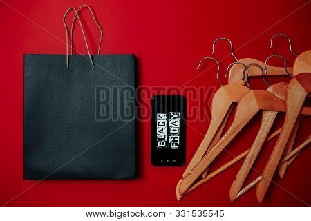 Black Friday Image With Space For Text. Bkack Friday Sale Flat Lay. Black Friday Bag. Hangers, Black