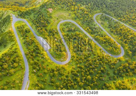 Aerial View Of Winding Road On Mountain In Autumn