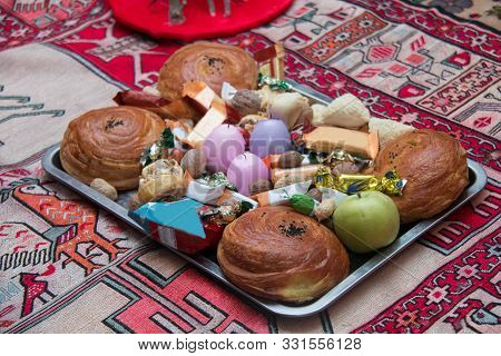 Candle . Khoncha . In Hell, Hazelnuts, Gooseberries. Cooking Qogals . Traditional Shekerbura, Mutaki