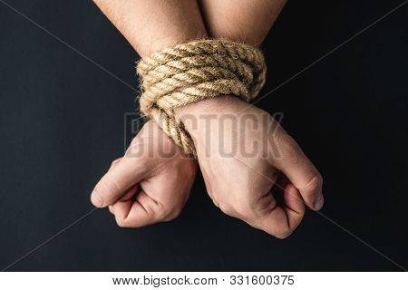 Hands Tied With A Rope On A Black Background, The Concept Of Stealing People, Right Day