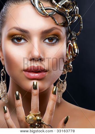 Golden Makeup and Jewelry.Fashion Model Portrait