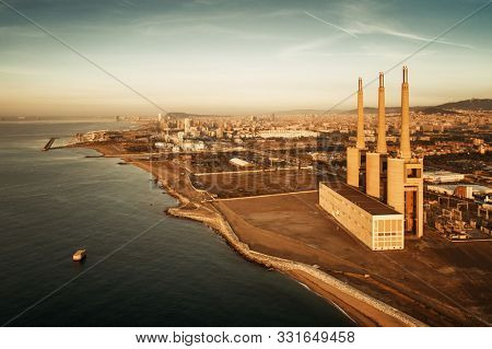 Besos thermic power plant aerial view at sunrise in Barcelona coast Spain.
