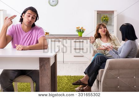 Young family and mother-in-law in family issues concept
