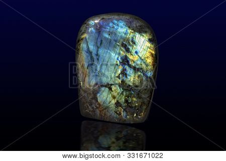 Beautiful Shiny Labradorite Gemstone On Dark Background