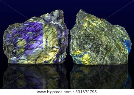 Polished Side And Raw Side Labradorite (labrador) Gemstone On Dark Background