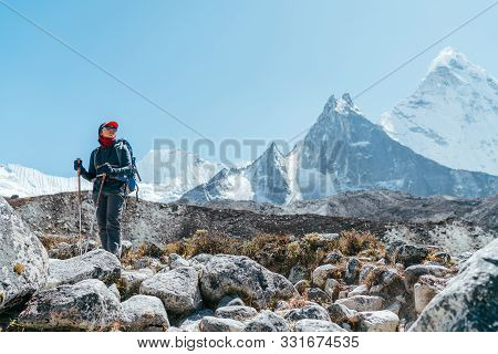 Young Hiker Backpacker Female Taking Brake In Hike Walking Enjoying Valley During High Altitude Ever