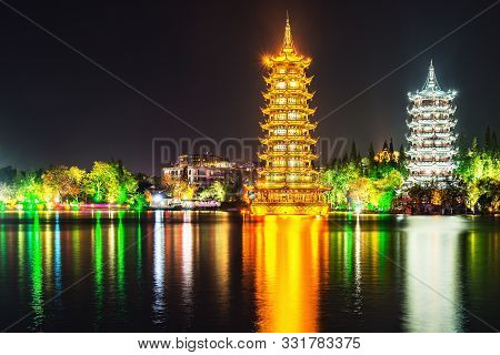 Sun And Moon Pagodas By The Shanhu Lake Fir Lake. Guilin. China.
