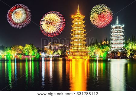 Fireworks Above Sun And Moon Pagodas By The Shanhu Lake Fir Lake. Guilin. China.