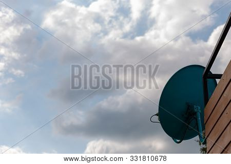 Satellite Dish On The Roof Of The House. The Installation Point Of The Satellite Dish.