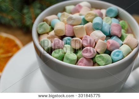 Marshmello With Cocoa In A Mug On A Surface Of Different Colors