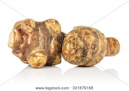 Group Of Two Whole Fresh Brown Jerusalem Artichoke Isolated On White Background