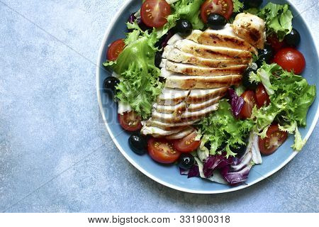 Grilled Chicken Breast With Vegetabe Salad. Top View With Copy Space.