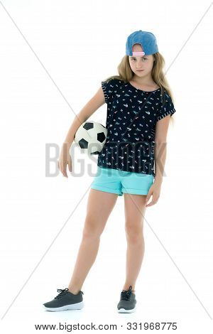 Adorable Little Girl With A Soccer Ball. The Concept Of Childrens Sports, Summer Outdoor Recreation.