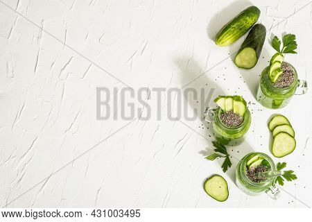 Green Smoothie With Cucumber In A Glass Jar. Fresh Ripe Vegetables, Greens, And Chia Seeds
