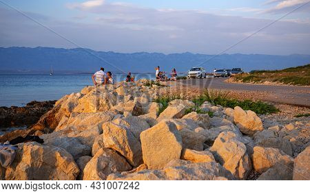 Vir, Croatia - July 28, 2021: Tourists Admire The Sunset On The Island Of Vir, Croatia.