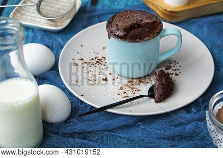 Mugcake Is Microwaved. Homemade Cupcake In A Mug Is On A Plate.