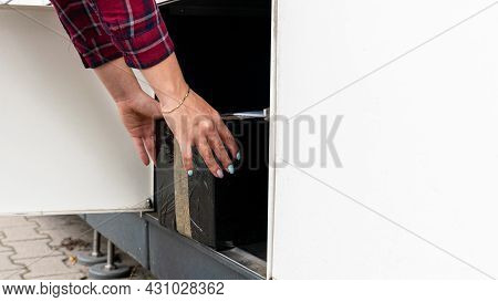 Automated Locker. Parcel Courier Box In Woman Hands At Post Delivery Automat Terminal. Courier Puts 