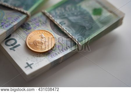 Warsaw, Poland 03.05.2021 A Gold Ducat And Two Packed Quantities Of Polish Money, Tied With Rubber B