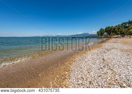 Beautiful Empty Beach On Lake Garda (lago Di Garda) Between The Small Villages Of Lazise, Bardolino 