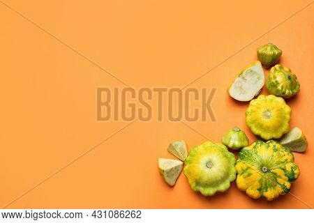Fresh Ripe Pattypan Squashes On Orange Background, Flat Lay. Space For Text