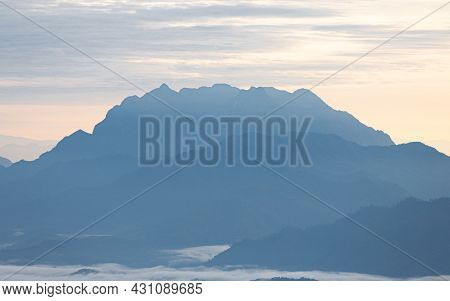 Hazy Blue Blue Mountain Range Called Doi Luang Chiangdao In Tropical Rainforest At Sunrise, Chiangma