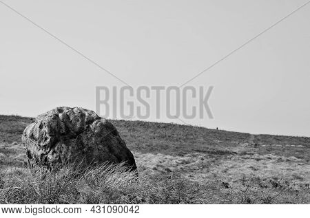 Monochrome Image Of A Pennine Landscape With Large Old Boulder Or Standing Stone On Midgley Moor In 