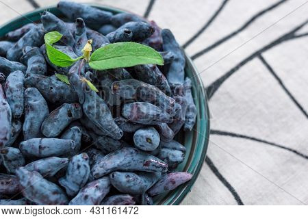 Closeup Fresh Blue Honeysuckle Or Haskap Berry On Plate On Fabric Napkin, Summer Fruit Dessert, Natu