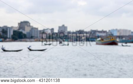 Abstract Blur And Defocused Busy River With Passing Boats And Trawlers In Bangladesh