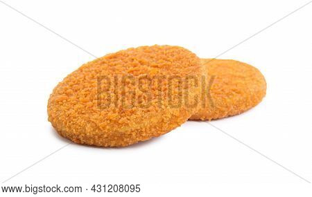 Uncooked Breaded Cutlets On White Background. Freshly Frozen Semi-finished Product