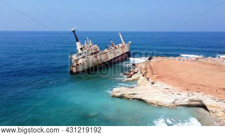 Abandoned Ship Near Cyprus Beach. Rusty Ship Ran Aground Near Shore