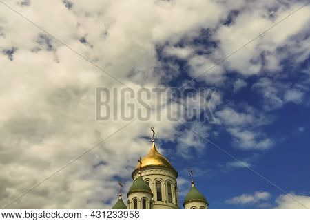 Golden Brilliant Dome Of A Christian, Orthodox Church With A Christian Orthodox Cross Close-up Again