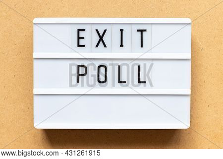 Lightbox With Word Exit Poll On Wood Background