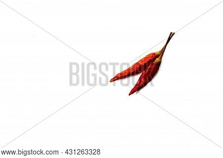Dry Red Hot Chili Peppers On White Background