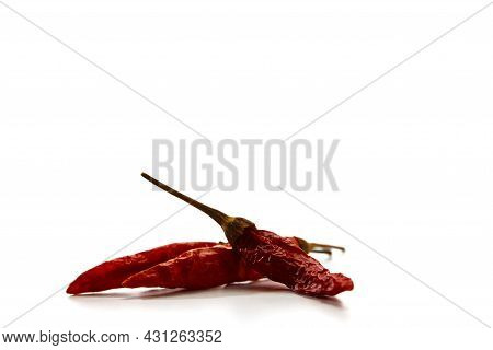 Dry Red Hot Chili Peppers On White Background