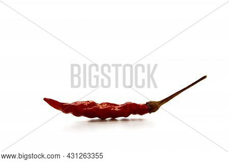 Dry Red Hot Chili Peppers On White Background