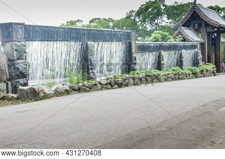 New Taipei City, Taiwan - January 27, 2012:  Waterfall Fence At Guan Dao Guan Ying Temple